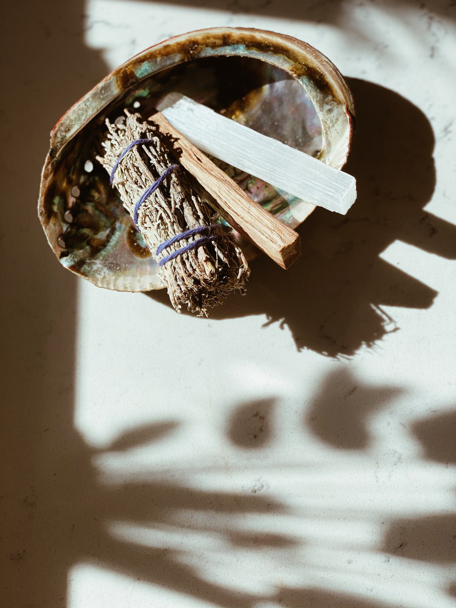 bundle of sage, palo Santo, selenite and abalone shell